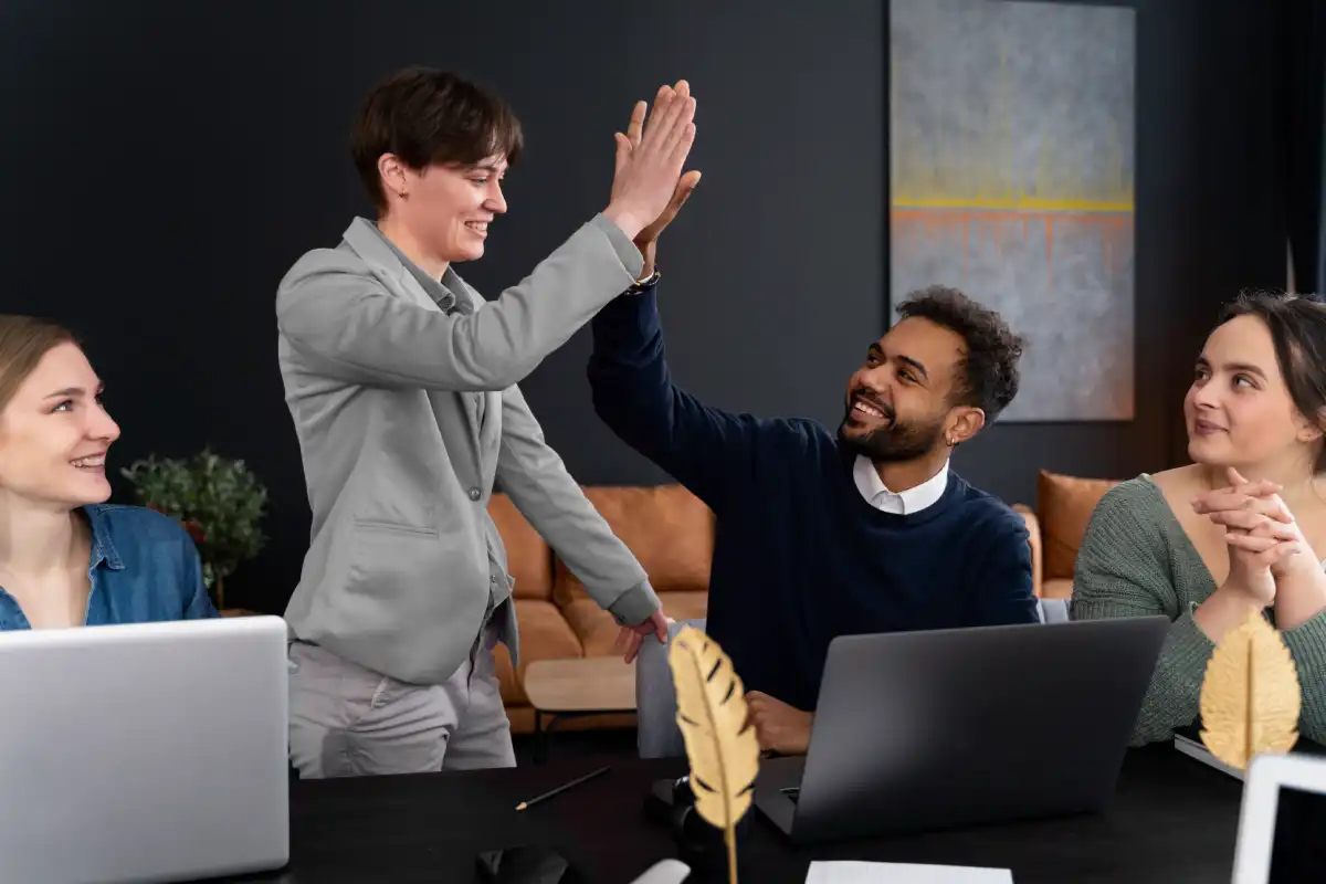 Team members collaborating in a modern office during a group discussion.
